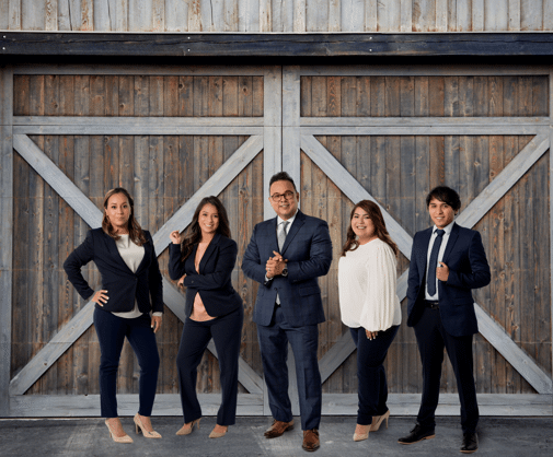 Attorney George Escobedo and team in front of barn door Attorney George Escobedo and team in front of barn door