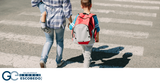 Woman and child walking across street