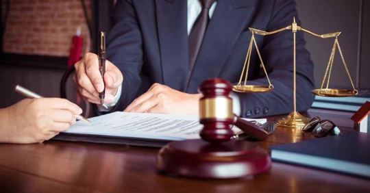 An attorney writing something down