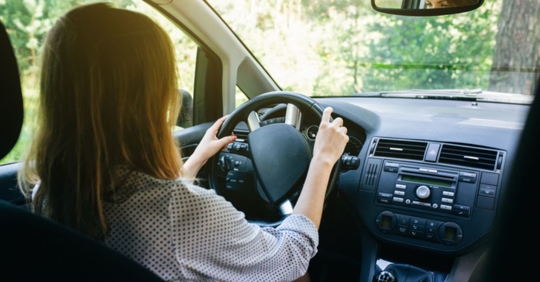 teen driver with hands on wheel