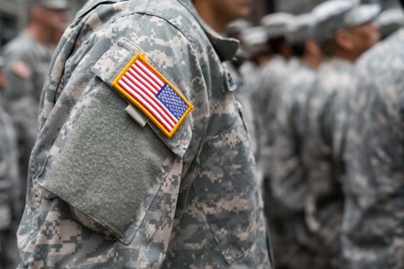soldier with american flag patch on shoulder